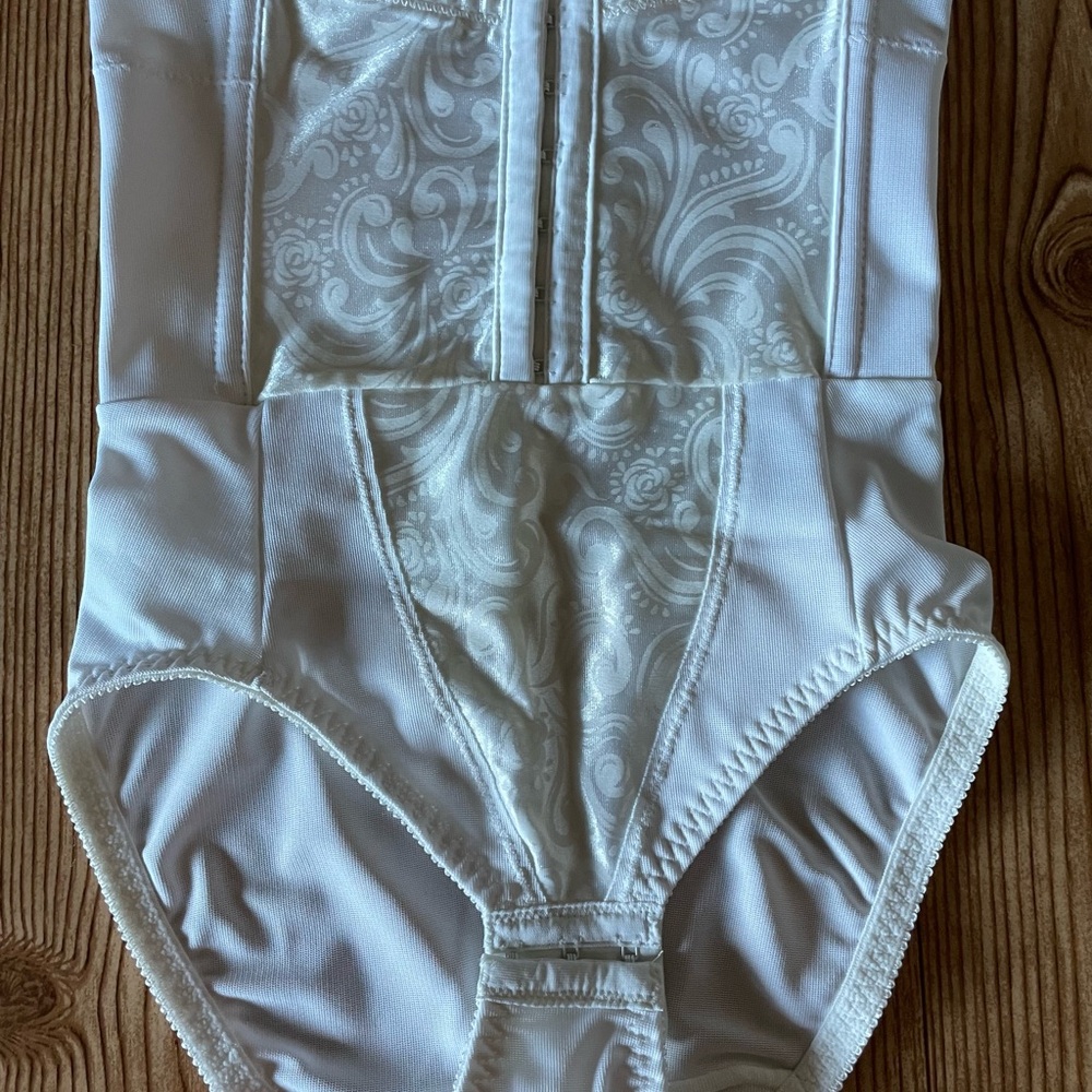 Cupid White Floral Bodysuit. Adonna cream satin bustier. Vanity fair cream skirt
